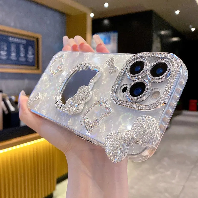 New Rhinestone Bow Tie Shell-Patterned KT Cat Glass Mirror Phone Case Cover Decorative Smartphone Protector for Iphone 16 15 14 13 12 Pro Max – Heart-Shaped Prismatic Protective Case